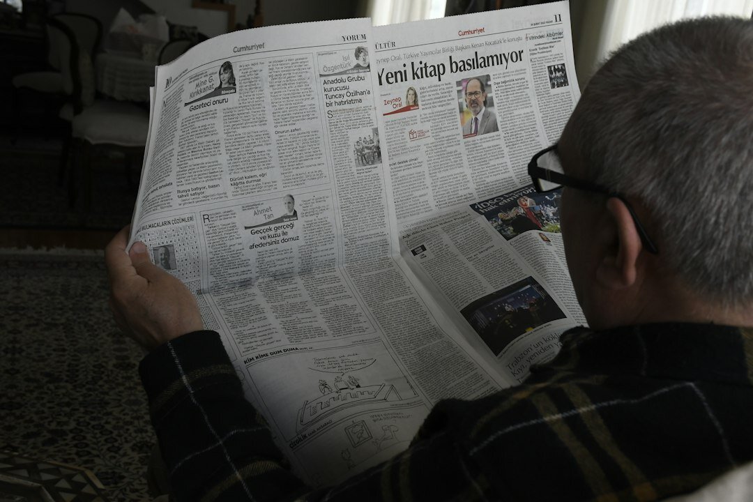senior reading newspaper