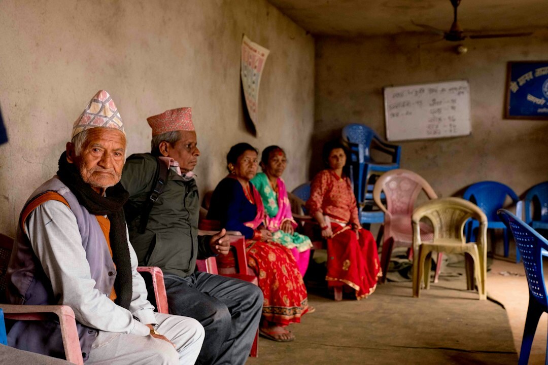 Senior citizens attending an educational class with a teacher