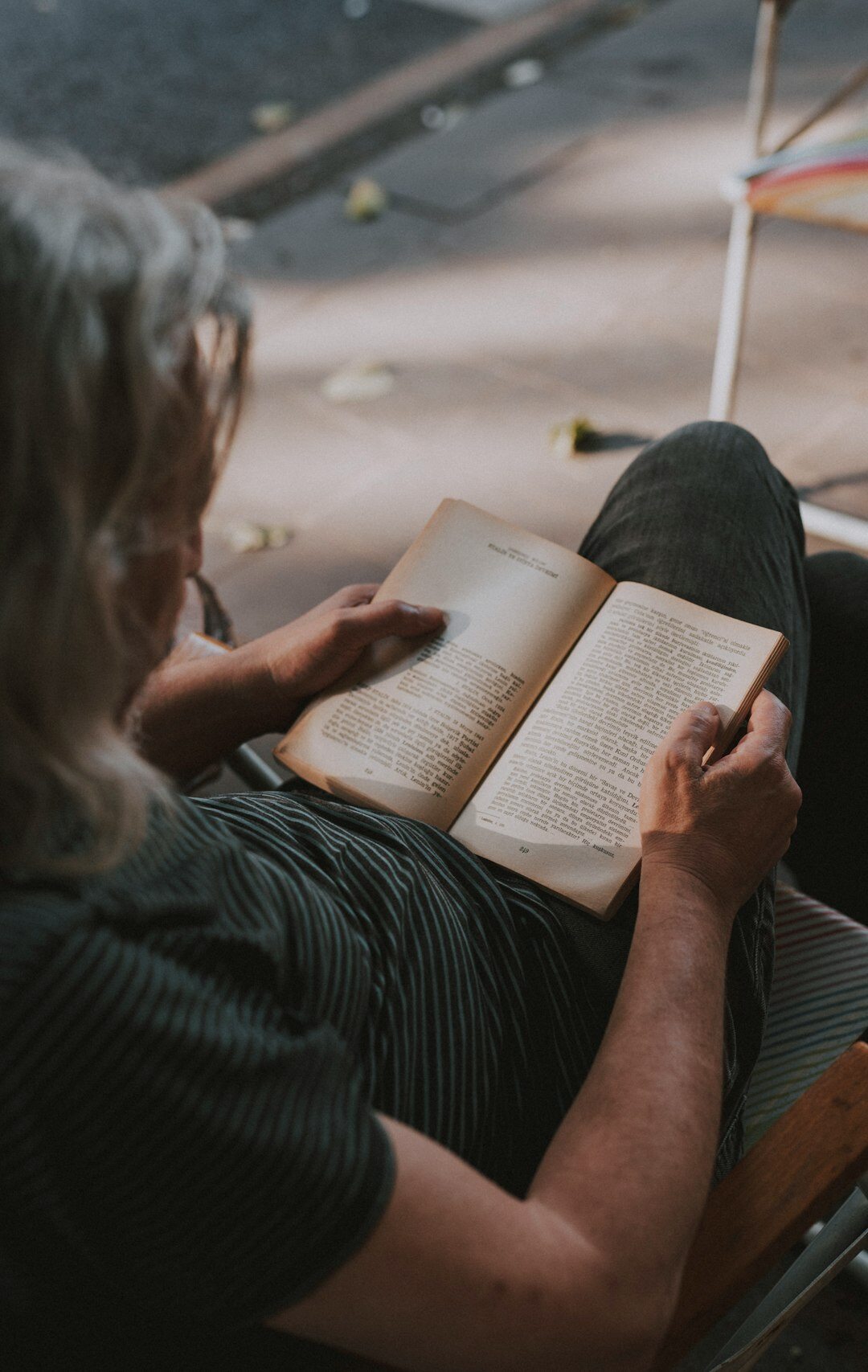 elderly woman reading book