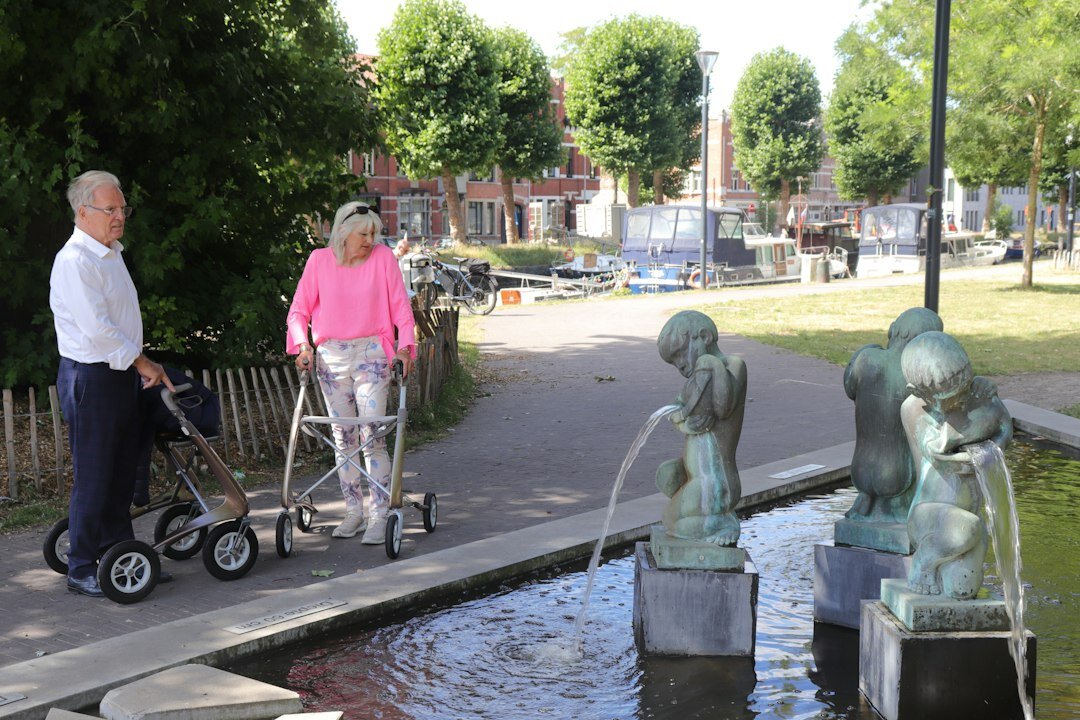 senior couple walking in park