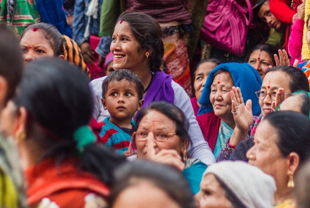 Group of senior citizens laughing together at a community gathering