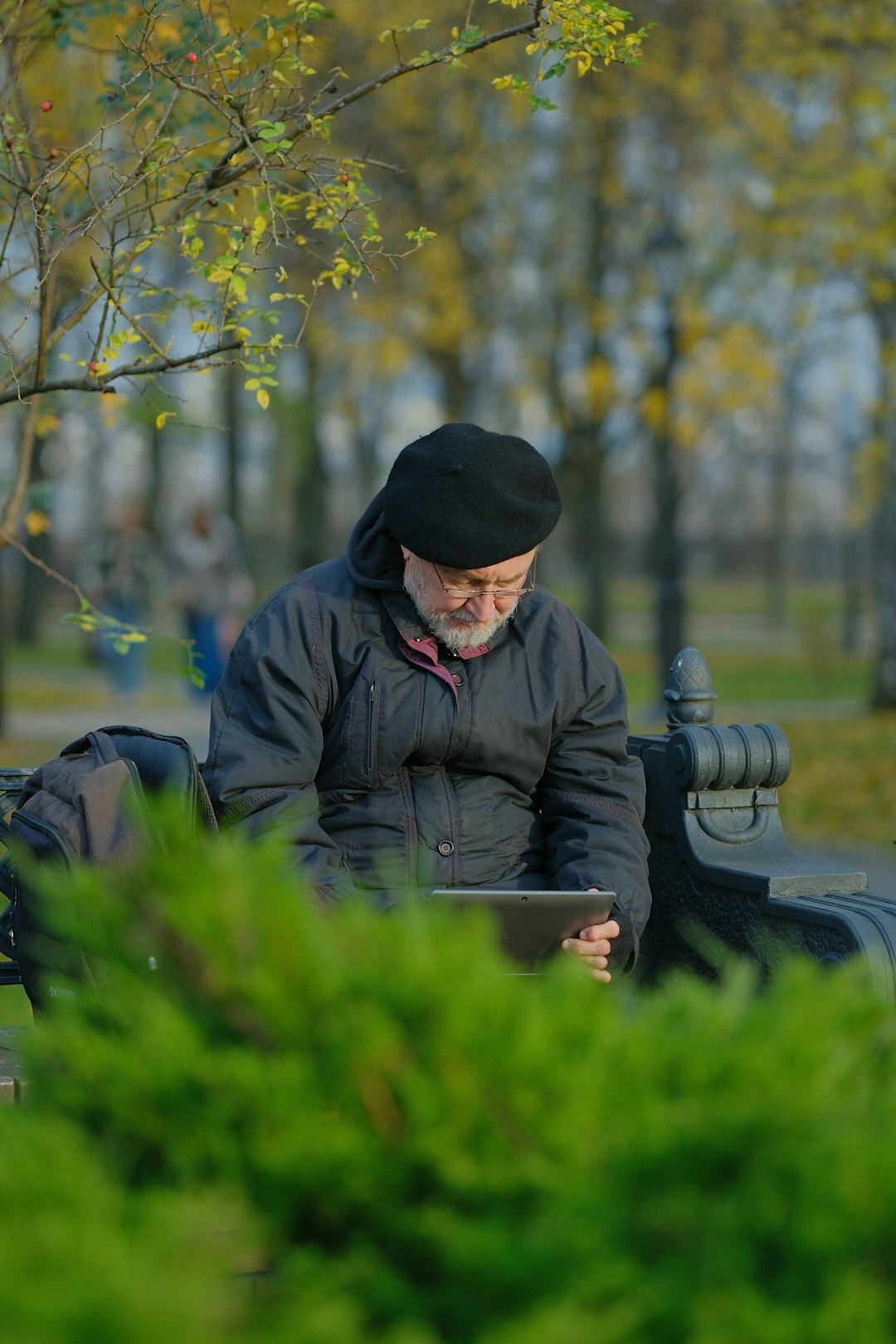 elderly person using tablet