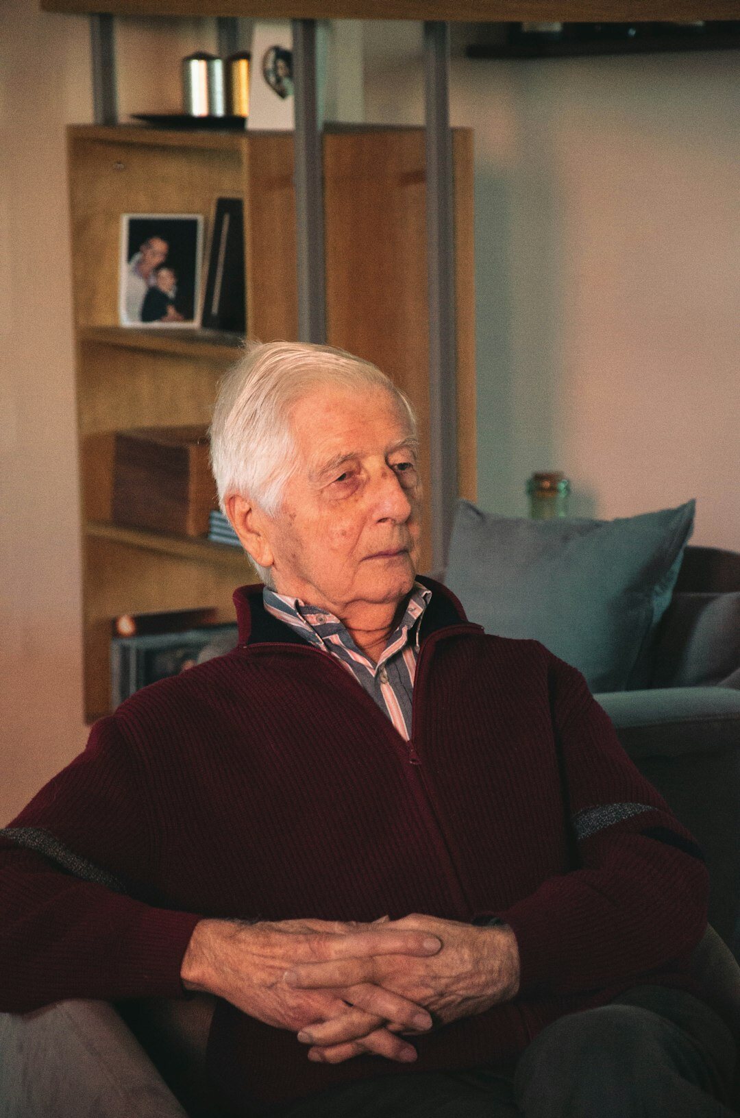 senior turning off lights at home