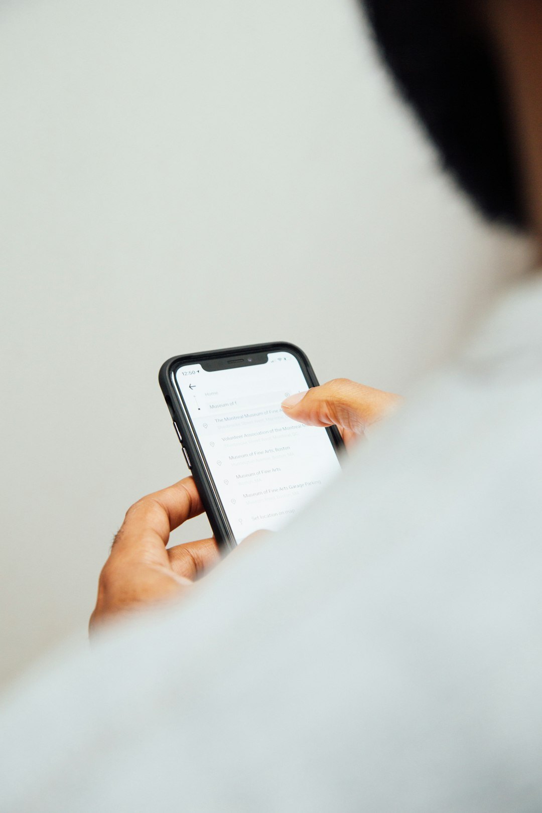 senior reading news on device